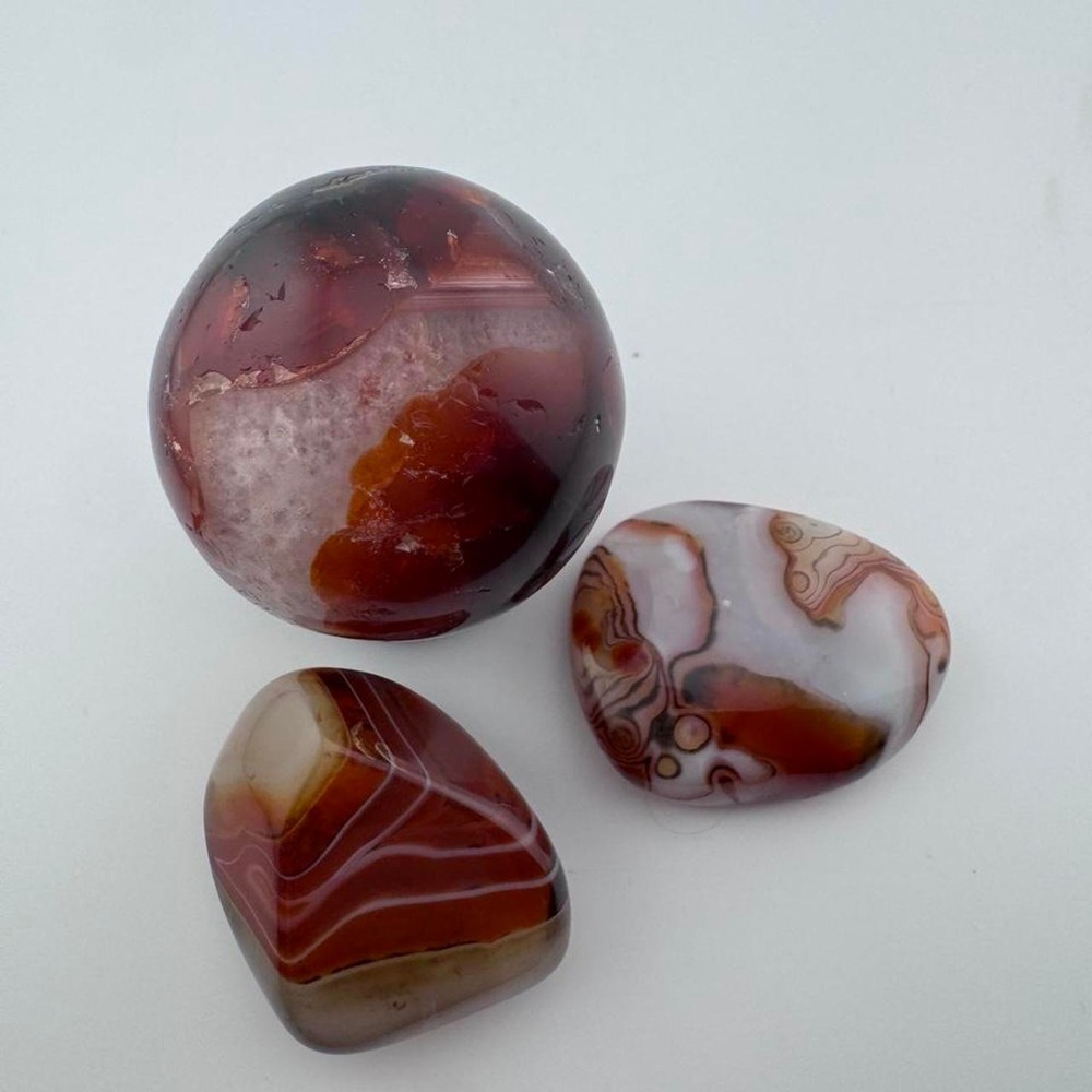 Sardonyx agate sphere and 2 palm stone set